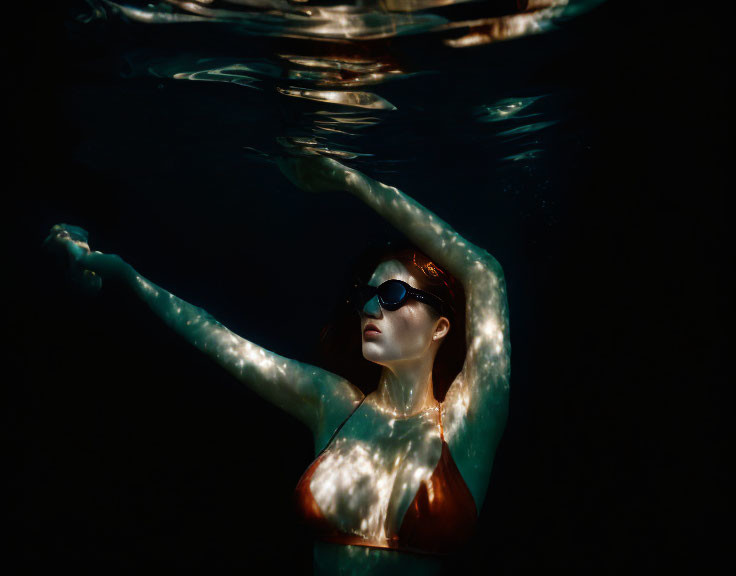 AI generated image of a woman drowning underwater with a black background